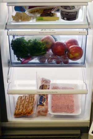 NSF INTERNATIONAL | ASSOCIATED PRESS
To avoid cross-contamination, NSF International recommends storing
vegetables in a separate drawer above the meat compartment to avoid raw juices dripping onto the produce.