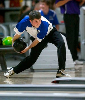 Washburn Rural's Cory Clausing hurls his ball down the lane during Thursday night's meet at West Ridge Lanes. Clausing finished first for the boys with a 699 series.