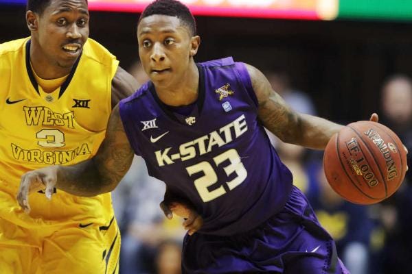 Kansas State guard Nigel Johnson, right, finished with 14 points, 5 assists, 5 rebounds and 3 steals in the Wildcats' road loss to West Virginia on Wednesday night.