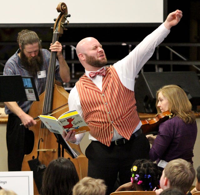 Jamie Mitchell • Times Record
Fort Smith Symphony Storybook Strings narrator Jim Loyd reads from Dr. Seuss’ “Fox in Sox” on Wednesday to Ballman Elementary School third-grade students with musical interpretation by a symphony quartet. The symphony’s new educational program provides classrooms with musical interpretation of children’s literature. During the presentations, the musicians explain the science behind the accompanying string instruments to lay the foundation for “Earquake!,” the symphony’s educational programs for fifth- and sixth-graders. 
 Jamie Mitchell - Times Record - Fort Smith Symphony Storybook Strings composer, Elizabeth Lyon, left, and narrator, Jim Loyd, read from Dr. Seuss' "Fox in Sox," Wednesday, Feb 11, 2015, to Ballman Elementary School third grade students with musical interpretation by a symphony quartet. The Symphony's new educational program provides classrooms with musical interpretation of children's literature. During the presentations, the musicians explain the science behind the accompanying string instruments to lay foundation for the Symphony's educational programs for fifth- and sixth-graders, "Earquake!" 
 Jamie Mitchell - Times Record - Fort Smith Symphony Storybook Strings composer, Elizabeth Lyon, left, and narrator, Jim Loyd, read from Dr. Seuss' "Fox in Sox," Wednesday, Feb 11, 2015, to Ballman Elementary School third grade students with musical interpretation by a symphony quartet. The Symphony's new educational program provides classrooms with musical interpretation of children's literature. During the presentations, the musicians explain the science behind the accompanying string instruments to lay foundation for the Symphony's educational programs for fifth- and sixth-graders, "Earquake!" 
 Jamie Mitchell • Times Record
Fort Smith Symphony Storybook Strings narrator Jim Loyd reads from Dr. Seuss’ “Fox in Sox” on Wednesday to Ballman Elementary School third-grade students with musical interpretation by a symphony quartet. The symphony’s new educational program provides classrooms with musical interpretation of children’s literature. During the presentations, the musicians explain the science behind the accompanying string instruments to lay the foundation for “Earquake!,” the symphony’s educational programs for fifth- and sixth-graders. 
 Jamie Mitchell - Times Record - Fort Smith Symphony Storybook Strings narrator, Jim Loyd, reads from Dr. Seuss' "Fox in Sox," Wednesday, Feb 11, 2015, to Ballman Elementary School third grade students with musical interpretation by a symphony quartet. The symphony's new educational program provides classrooms with musical interpretation of children's literature. During the presentations, the musicians explain the science behind the accompanying string instruments to lay foundation for the symphony's educational programs for fifth- and sixth-graders, "Earquake!"