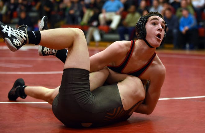 Cinnaminson's Jarod Averill (top) shown during a regular season match, had a key pin for the Pirates win Friday night. Photo by William Johnson