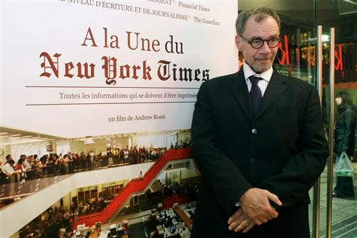 FILE - In this Nov. 21, 2011, file photo, New York Times journalist David Carr poses for a photograph as he arrives for the French premiere of the documentary "Page One: A Year Inside The New York Times," in Paris. Carr collapsed at the office and died in a hospital Thursday, Feb. 12, 2015. He was 58. Carr wrote the Media Equation column for the Times, focusing on issues of media in relation to business and culture.