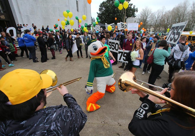 The University of Oregon mascot dances to the music of the Oregon Marching band after the rally at the state Capitol on Thursday. (Brian Davies/The Register-Guard)