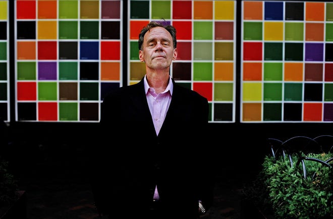 In this Aug. 11, 2008, file photo, David Carr, culture reporter and media columnist for The New York Times poses for a photograph on Eighth Avenue, in New York. Carr collapsed at the office and died in a hospital Thursday, Feb. 12, 2015. He was 58. Carr wrote the Media Equation column for the Times, focusing on issues of media in relation to business and culture.