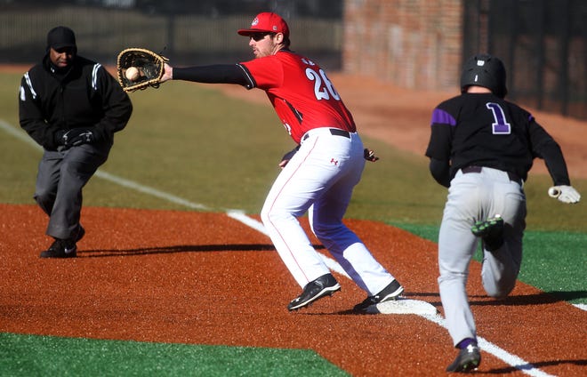 Gardner-Webb’s Patrick Graham takes the throw at first to put out James Madison runner Chad Carroll during the season opener game at Gardner-Webb University on Friday. The visiting Dukes rallied for a 9-6 win. (Brittany Randolph / The Star)