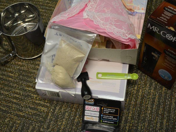These are among the drugs and items seized by authorities during a heroin trafficking investigation that resulted in the arrests of three Wilmington men. Contributed photo
