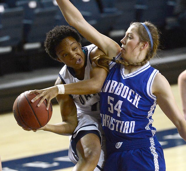 BRIAN D. SANDERFORD • TIMES RECORD UAFS' Skai Thompson, left, works the ball around Lubbock Christian's Tess Bruffey during the first half on Thursday, Feb. 12, 2015 at the Stubblefield Center. 
 BRIAN D. SANDERFORD • TIMES RECORD UAFS' Angi Ramey, left, shoots as Lubbock Christian's Kellyn Scheider defends during the first half on Thursday, Feb. 12, 2015 at the Stubblefield Center.