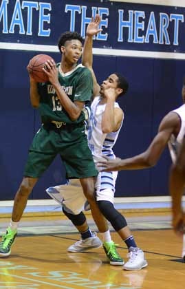 Kinston's Brandon Ingram gets ready to drive to the basket as South Lenoir's Donoven Williams defends in the second quarter at South Lenoir High School.