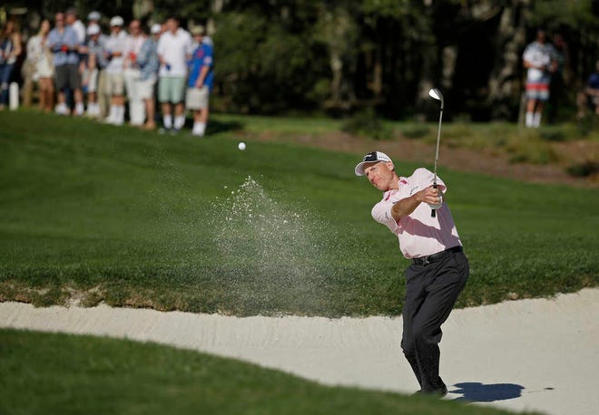 Jim Furyk hits out of a bunker onto the second green of the Pebble Beach Golf Links during the third round of the AT&T Pebble Beach National Pro-Am golf tournament Saturday, Feb. 14, 2015, in Pebble Beach, Calif. (AP Photo/Eric Risberg)