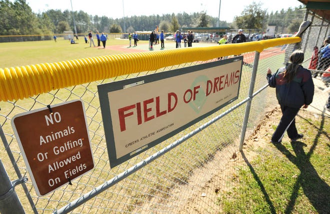 Bob.Self@jacksonville.com--2/14/15--The sign on the third base line fence. The 2015 baseball season at the Field of Dreams in NW St. Johns County kicked of Saturday morning as the nonprofit organization is trying to raise $200,000 to repair the artificial turf field used by the special needs children who play there. This is the fifth season for the organization that started small and has grown to involve children from around North East Florida. (The Florida Times-Union/Bob Self)