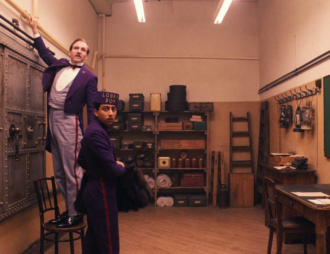 This image released by Fox Searchlight shows Ralph Fiennes, left, and Tony Revolori in 'The Grand Budapest Hotel.' The film is nominated for an Oscar Award for best feature. The 87th Annual Academy Awards will take place on Feb. 22 at the Dolby Theatre in Los Angeles.
