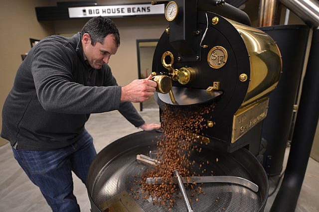 John Krause, the owner of Big House Beans in Antioch, Calif., roasts a small batch of coffee beans inside his warehouse on January 16, 2015. As a former San Quentin Prison inmate, Krause turned his life around starting with recovery from addiction, a wife and family, and his new company. (Dan Rosenstrauch/Bay Area News Group/TNS) 
 Customers Mario Basulto, left, and his wife, Abra Basulto, center, and their son Junior, 1, visit with John Krause, the owner of Big House Beans in Antioch, Calif., as he makes them a cup of coffee on January 16, 2015. As a former San Quentin Prison inmate, Krause turned his life around starting with recovery from addiction, a wife and family, and his new company. (Dan Rosenstrauch/Bay Area News Group/TNS) 
 John Krause, the owner of Big House Beans in Antioch, Calif., makes a cup of coffee for a customer on January 16, 2015. As a former San Quentin Prison inmate, Krause turned his life around starting with recovery from addiction, a wife and family, and his new company. (Dan Rosenstrauch/Bay Area News Group/TNS) 
 John Krause, the owner of Big House Beans in Antioch, Calif., roasts a small batch of coffee beans inside his warehouse on January 16, 2015. As a former San Quentin Prison inmate, Krause turned his life around starting with recovery from addiction, a wife and family, and his new company. (Dan Rosenstrauch/Bay Area News Group/TNS) 
 John Krause, the owner of Big House Beans in Antioch, Calif., wheels out a container of green coffee beans to be roasted inside his warehouse on January 16, 2015. As a former San Quentin Prison inmate, Krause turned his life around starting with recovery from addiction, a wife and family, and his new company. (Dan Rosenstrauch/Bay Area News Group/TNS)