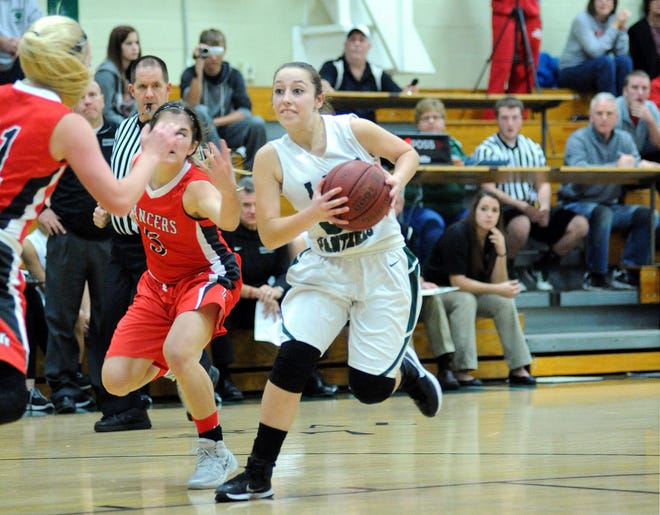 Katie Stang (30) of Riverside moves past Neshannock defenders during their Dec. 22 game.