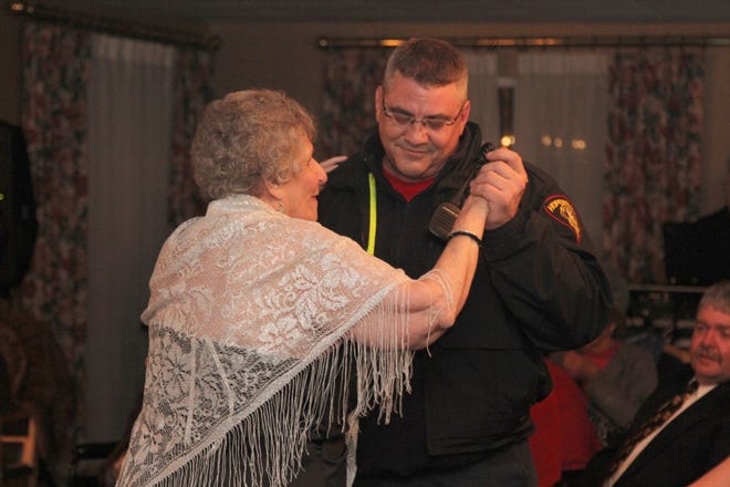 Hopewell firefighter Shawn Jones dances with BettyBurford at the senior prom sponsored by Brighter Living Assisted Living in Hopewell. PHOTO COURTESY OF STEPHANIE LAWRENCE OF WILLOW PHOTOGRAPHY
