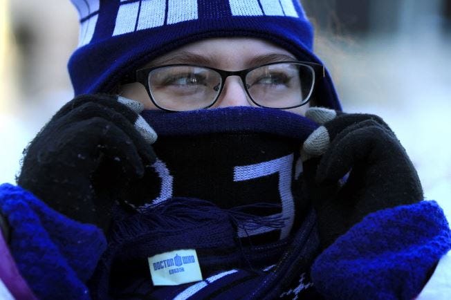 Cara Nason of Warwick bundles up against the cold as she walks down Dorrance Street in Providence Monday morning. She says she dreads the wait for the bus this afternoon on her way back from school.
