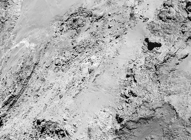 Images taken by the Rosetta space probe on Saturday show boulders on comet 67P/Churyumov-Gerasimenko, plus details of the terrain, European Space Agency scientists said yesterday. Rosetta passed less than 4 miles above the comet's surface.