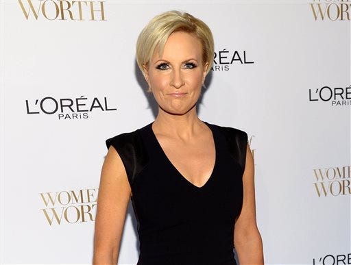 In this Dec. 2, 2014, file photo, Mika Brzezinski arrives at the Ninth Annual Women of Worth Awards in New York. The NBC Universal News Group is launching a series of live events where "Morning Joe" host Brzezinski offers empowerment tips to women, a venture that illustrates an effort to find revenue-raising activities outside the traditional definition of news. (Photo by Evan Agostini/Invision/AP, File)