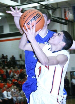 Kewanee’s Tanner Arzola takes it to the bucket during Tuesday night’s Three Rivers East battle with Princeton.