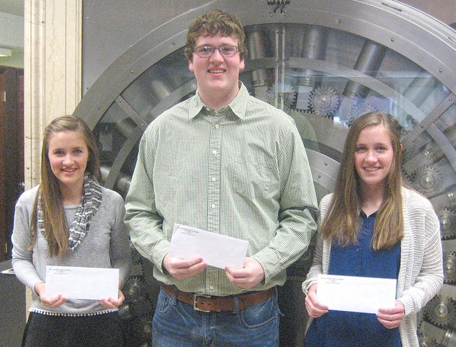 Winners (from left) Kaitlyn Cline, Brock Titlow and Kylie Cline accept their checks from PNB for winning the Community Bankers Association of Illinois essay contest.