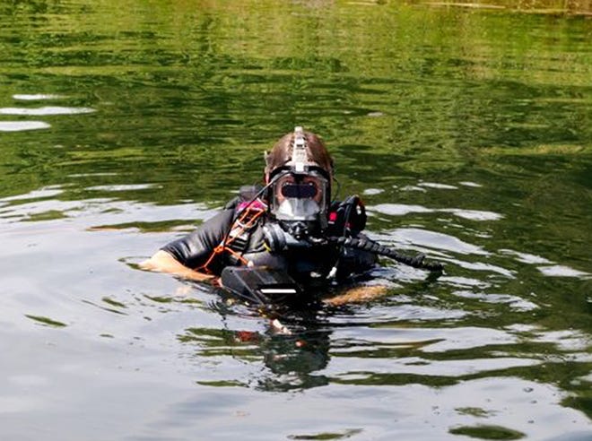 A scientist tests an advanced diving mask created at Naval Surface Warfare Center Panama City Division in July 2010.