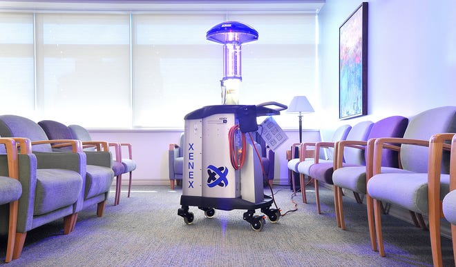 The Xenex robot begins to pulse xenon ultraviolet light to destroy dangerous microorganisms and reduce germs.