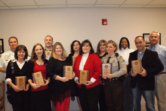 Men and women honored this month as Gaston County’s 2014 Employees of the Year, pictured from left to right, include: (back row) Chris Hendricks, Joseph Anderson, Naomi Paul, Sherry Michael, Sonja Floyd, Steve Wilkins; (front row) Pam Briant, Sarah Miller, Jenny Brown, Wanda Clemmer, Deputy Julie Stillwell and Juan Garcia. Not pictured is Gaston County Police Detective Joe Burch.