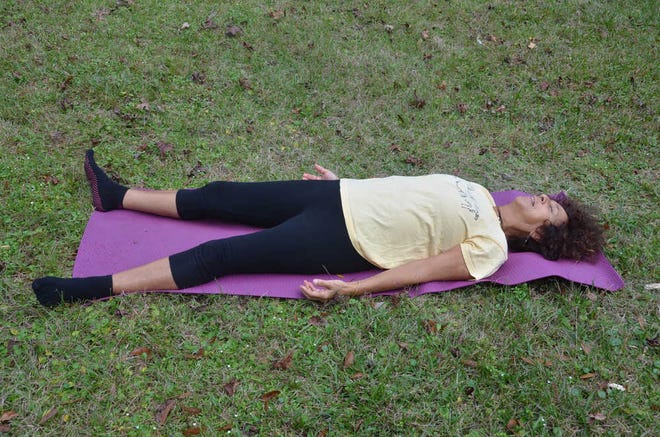 Certified yoga therapist Gita Carpenter demonstrates the final relaxation pose.