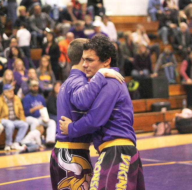Bronson seniors Kahle Scheenks and JuKoada Sexton share a huge after the season-ending loss to Hudson on Wednesday.