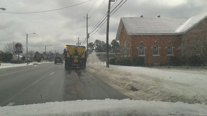 DOT truck clearing road in Dunn after winter ice storm on Tuesday, Feb. 17, 2015.