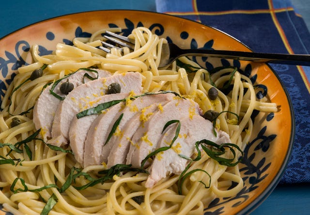 The mild flavor of gently simmered chicken gets a boost from Mediterranean staples of lemon, basil, garlic and capers. (Zbigniew Bzdak/Chicago Tribune/TNS)