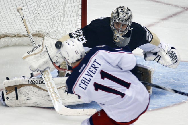 Penguins' Marc-Andre Fleury (29) makes save on a shot by Blue Jackets' Matt Calvert (11) in the first period Thursday, in Pittsburgh.