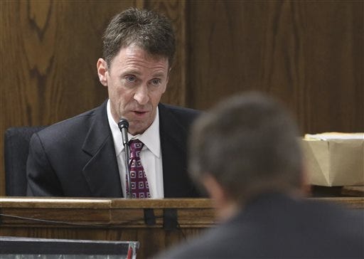 Psychiatrist Dr. Mitchell H. Dunn testifies during the capital murder trial of Former Marine Cpl. Eddie Ray Routh at the Erath County, Donald R. Jones Justice Center Thursday, Feb. 19, 2015, in Stephenville, Texas. Routh is charged with the 2013 deaths of former Navy SEAL Chris Kyle and his friend Chad Littlefield at a shooting range near Glen Rose, Texas. (AP Photo/LM Otero,Pool)
