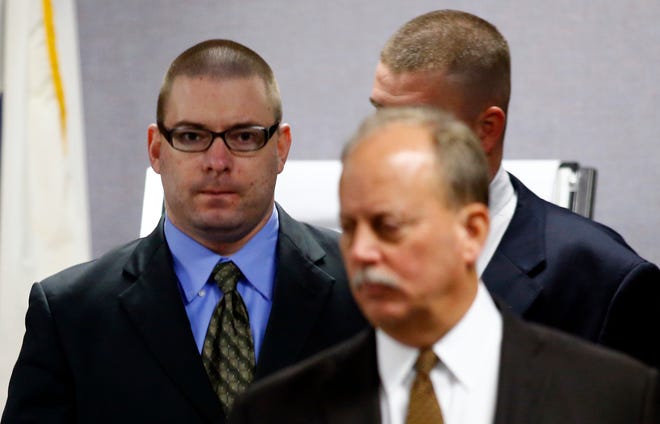 Eddie Ray Routh, left, enters the courtroom with Defense Attorney J. Warren St. John following a break in his capital murder trial at the Erath County, Donald R. Jones Justice Center in Stephenville, Texas, on Wednesday, Feb. 18, 2015.