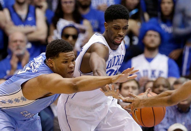 Duke's Amile Jefferson, right, and North Carolina's Kennedy Meeks reach for the ball during their game in Durham, N.C., on Wednesday, Feb. 18, 2015.