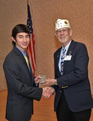 Ryuki Deyton, left, receives the third place medal from Harry Flynn, Commander of the Fifth Division of the North Carolina American Legion. Photo submitted by American Legion