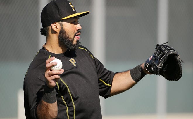 Pittsburgh Pirates' Pedro Alvarez warms up during an informal spring training baseball workout in Bradenton, Fla., Thursday, Feb. 19, 2015. Pirates pitchers and catcher get underway with the first official workout of the spring this afternoon. (AP Photo/Gene J. Puskar)