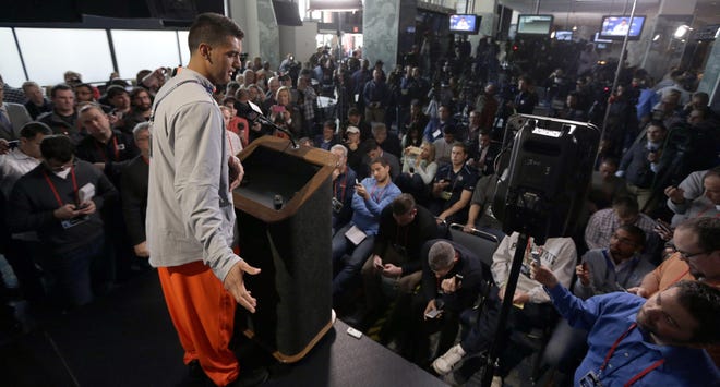 Oregon quarterback Marcus Mariota answers a question during a news conference at the NFL football scouting combine in Indianapolis, Thursday, Feb. 19, 2015. (AP Photo/David J. Phillip)