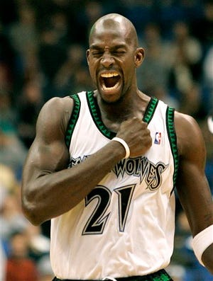 FILE - In this Nov. 25, 2006, file photo, Minnesota Timberwolves forward Kevin Garnett pumps his fist to his chest before the start of the basketball game against the Los Angeles Clippers in Minneapolis. Garnett is coming back to the place it all began. A person with knowledge of the deal says the Minnesota Timberwolves are sending forward Thaddeus Young to the Brooklyn Nets for Garnett. The person spoke Thursday, Feb. 19, 2015, on condition of anonymity because the deal had not been officially announced. (AP Photo/Andy King, File)