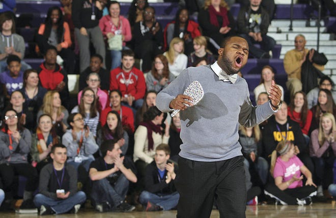 John Gaines/The Hawk Eye Marcus Timmon grooves to the Michael Jackson song "Man in the Mirror" at the conclusion of the Minority Scholars assembly Thursday at the Burlington High School gym in Burlington. The event takes place during Black History Month and combines education with entertainment for the students.