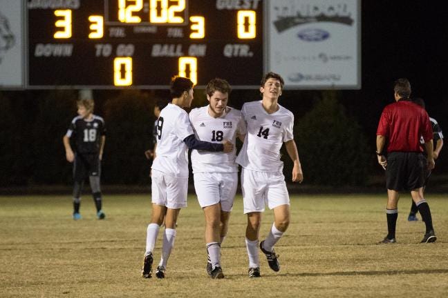 In this October 2014 photo, Forestview's Jeff Friday is congratulated by his team mates after scoring the team's 3rd goal of the night. Brian C. Mayhew/Special to The Gazette