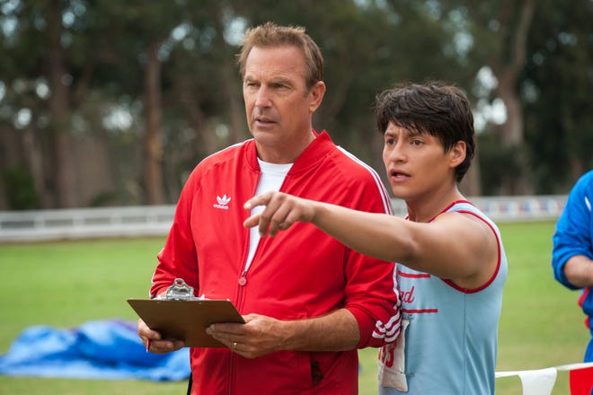 In this image released by Disney, Kevin Costner, foreground left, and Carlos Pratts appear in a scene from "McFarland, USA." (Disney, Ron Phillips)