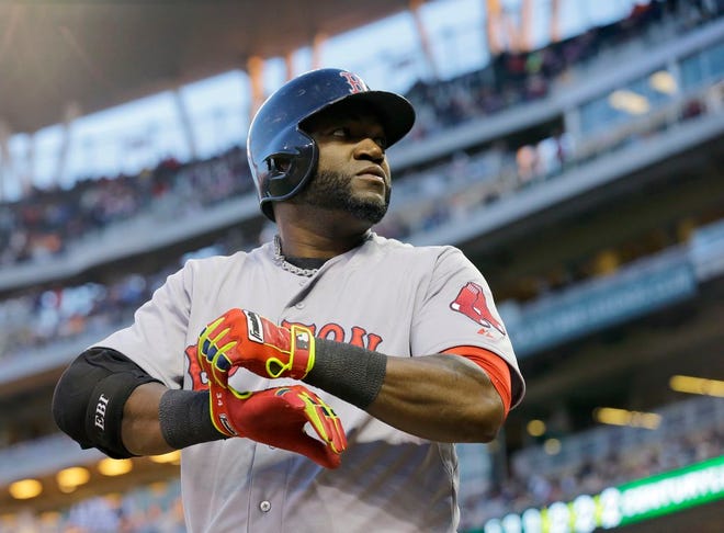 In this May 14, 2014, file photo, Boston Red Sox designated hitter David Ortiz prepares to bat during the fourth inning of a baseball game against the Minnesota Twins in Minneapolis. Major League Baseball is making some changes to speed up the length of games but it won't implement some of the more radical proposals to make games shorter. The league and the players' union announced an agreement Friday, Feb. 20, 2015, to enforce the rule requiring a hitter to keep at least one foot in the batter's box in most cases. MLB also will post stadium clocks timing pitching changes and between-inning breaks.