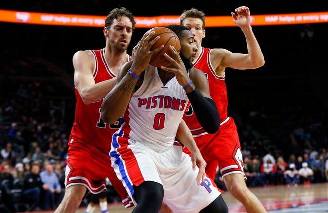 Detroit Pistons center Andre Drummond (0) is defended by Chicago Bulls forward Pau Gasol, left, and Chicago Bulls forward Mike Dunleavy, right, in the first half of an NBA basketball game in Auburn Hills, Mich., Friday, Feb. 20, 2015.