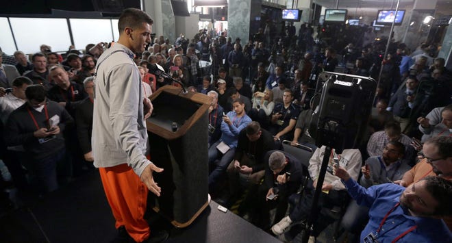 Oregon’s Marcus Mariota answers a question at the NFL combine Thursday in Indianapolis. (AP Photo/David J. Phillip)