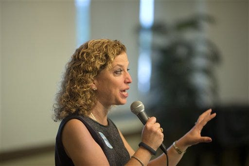 In this Oct. 21, 2014 file photo Democratic National Committee (DNC) Chair, Rep. Debbie Wasserman Schultz, D-Fla. speaks in Plantation, Fla. Democrats are struggling to answer a simple question _ "What's a Democrat?" _ and need to do a better job of explaining its core values to voters, according to a task force formed by the party following its dismal 2014 elections. The DNC on Saturday released the interim findings of a panel charged with addressing problems in recent mid-term elections. The report said Democrats lack a "cohesive narrative" for the party and recommends finding ways to help it explain party values such as fairness, equality and opportunity. (AP Photo/J Pat Carter, File)