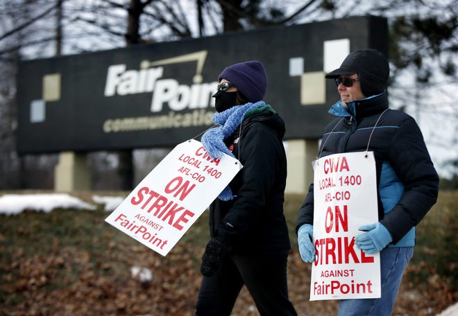 Fairpoint employees Amber Lyman, left, and Julie Sawtelle picket outside the company's offices in Portland, Maine late last month. Union leaders say a tentative deal has been reached to end the four-month strike, with ratification votes ongoing this weekend.

Robert F. Bukaty/Associated Press file