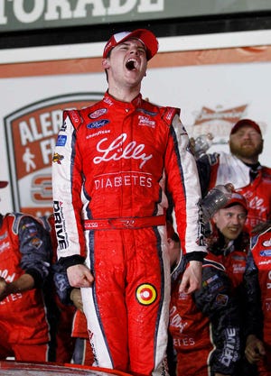 Ryan Reed celebrates in Victory Lane after winning the NASCAR Xfinity series auto race at Daytona International Speedway in Daytona Beach, Fla., Saturday, Feb. 21, 2015. (AP Photo/Terry Renna)