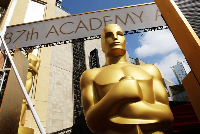An Oscar statue is seen as preparations are made for the 87th Academy Awards in Los Angeles, Saturday, Feb. 21, 2015. The Academy Awards will be held at the Dolby Theatre on Sunday, Feb. 22. (Photo by Matt Sayles/Invision/AP)