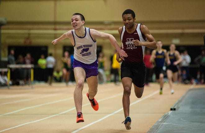 Despite the late lean of Monroe-Woodbury's Jack Jibb, left, Kingston's Rastafari Morgan won the 1,000 meters by two-hundreds of a second. Kelly Marsh/For the Times Herald-Record