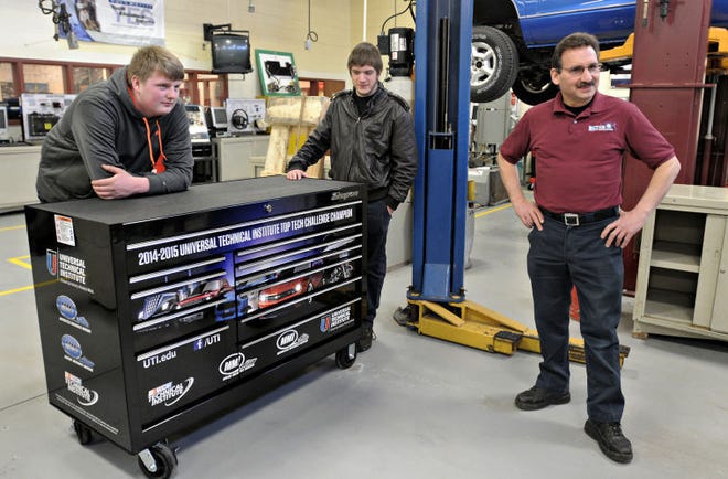 The 2014-2015 Universal Technical Institute Top Tech Challenge winners, (from left), Steven Surrick and Tim McDonald along with their Automtive instructor Byron Cesari receive their prize a $10,000 Snap-On toolbox Wednesday, Feb. 18, 2015 at Bucks County Technical High School in Bristol Township.